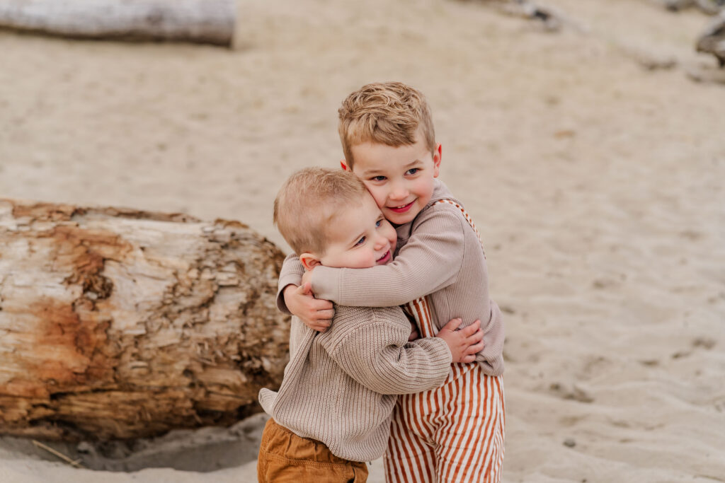 family wearing neutral colors during Oregon Coast beach photography session