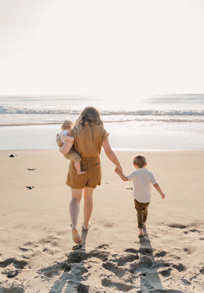 family walking on the beach during an Oregon Coast family photography session