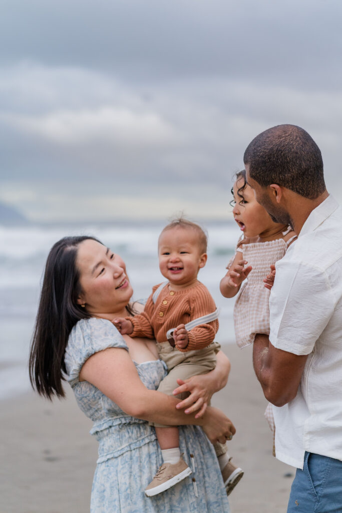 Family enjoys the beach at Pacific City, Oregon